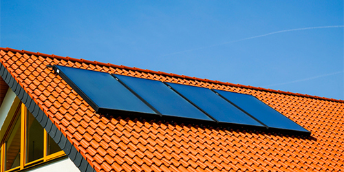 An installation of a Grant Solar Thermal installation featuring 4 on-roof collectors