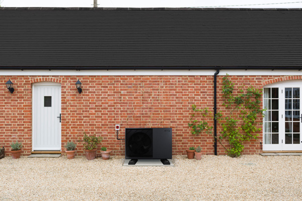 An installed Grant Aerona 290 air source heat pump