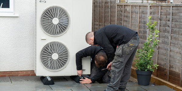 installers-fitting-an-air-source-heat-pump.jpg