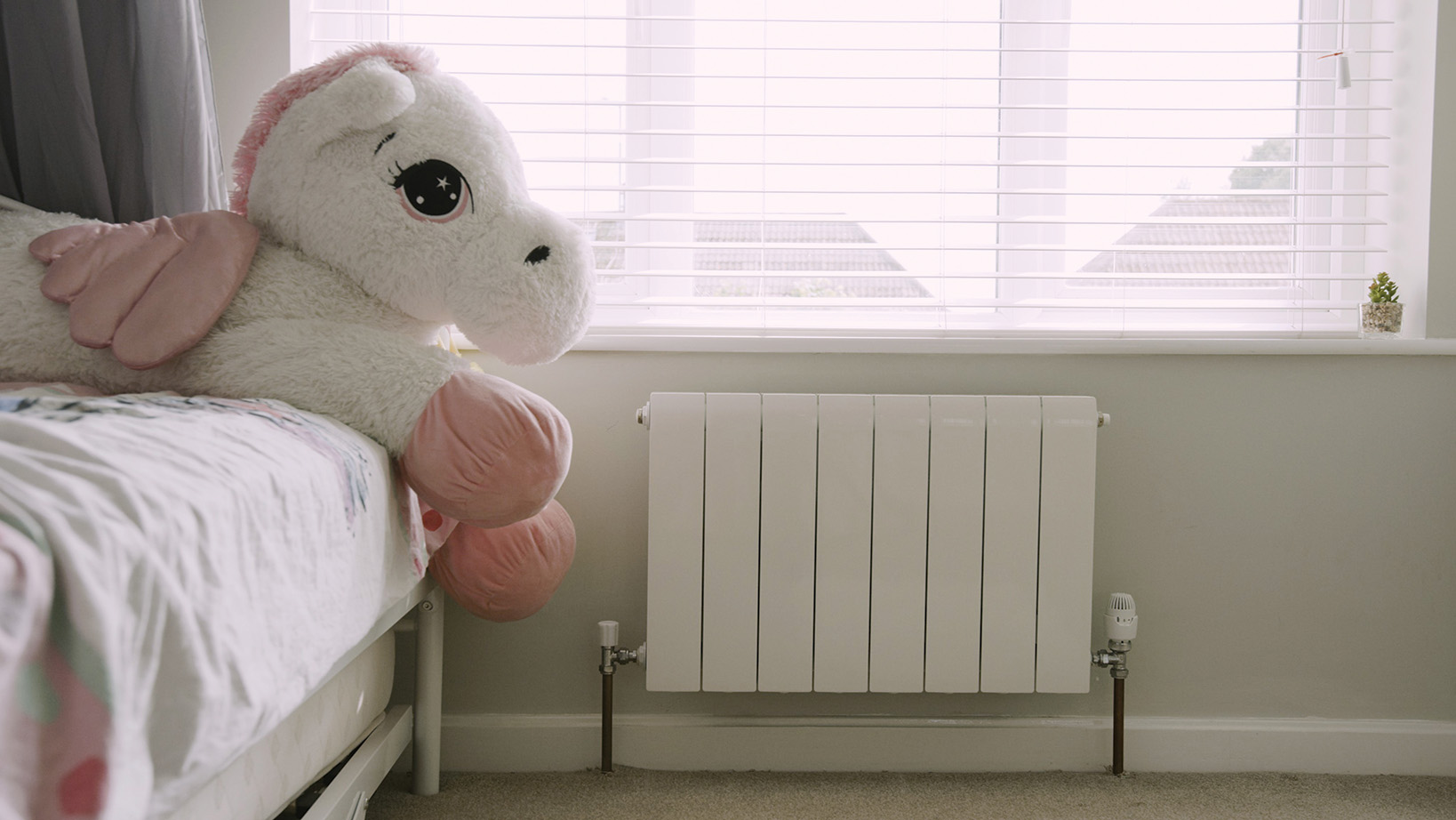 Grant Afinia radiator child's bedroom with cuddly toy