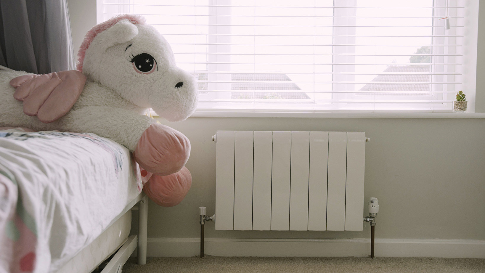 Grant Afinia radiator child's bedroom with cuddly toy