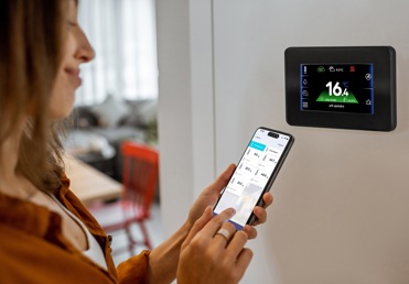 homeowner using ecoNET app with Aerona Smart Controller
